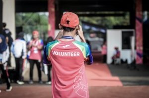 Man in Volunteer Shirt